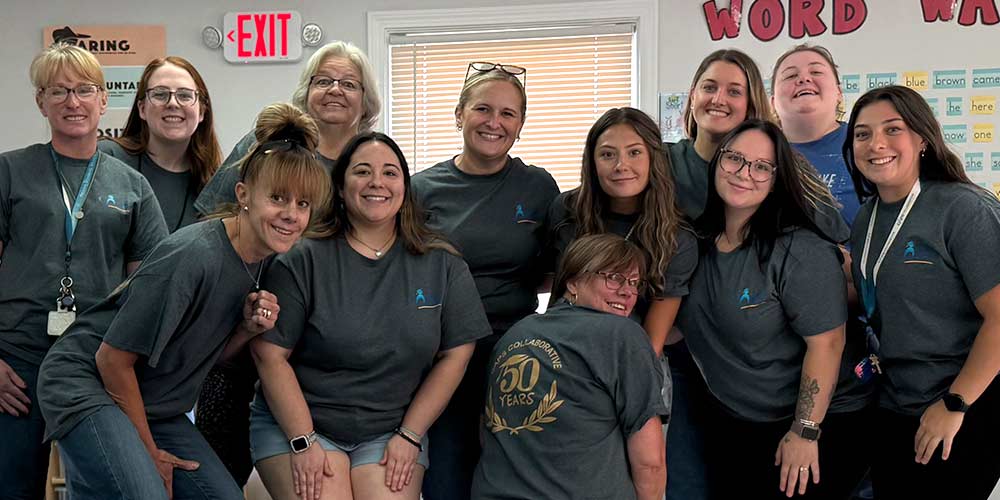 Photo Copyright: AIS Brightly lit AIS Showroom featuring vignettes of modern office furniture and a large blue column in the middle with a backlit AIS sign. (Photo copyright: AIS)