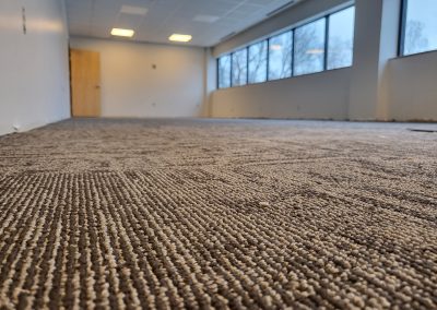 Close up of new carpeting in one of the large flexible spaces in the Adult Day Program building.